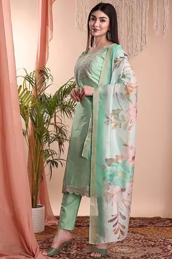 Pista color art silk embroidered yoke design kurti pant dupatta set.