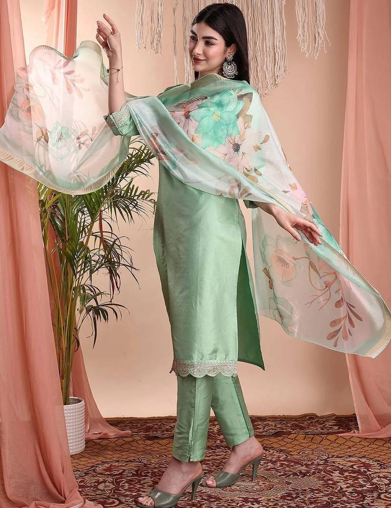 Pista color art silk embroidered yoke design kurti pant dupatta set.