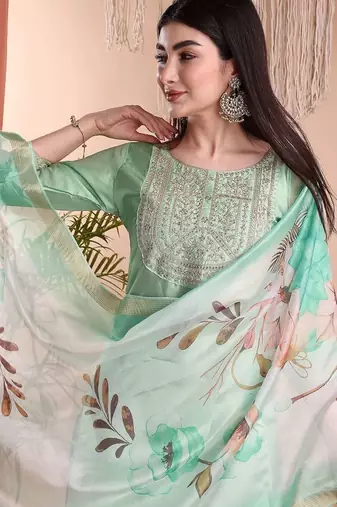 Pista color art silk embroidered yoke design kurti pant dupatta set.