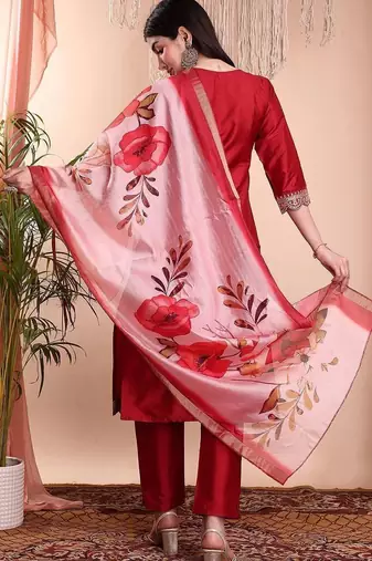 Red color art silk embroidered yoke design kurti pant dupatta set.