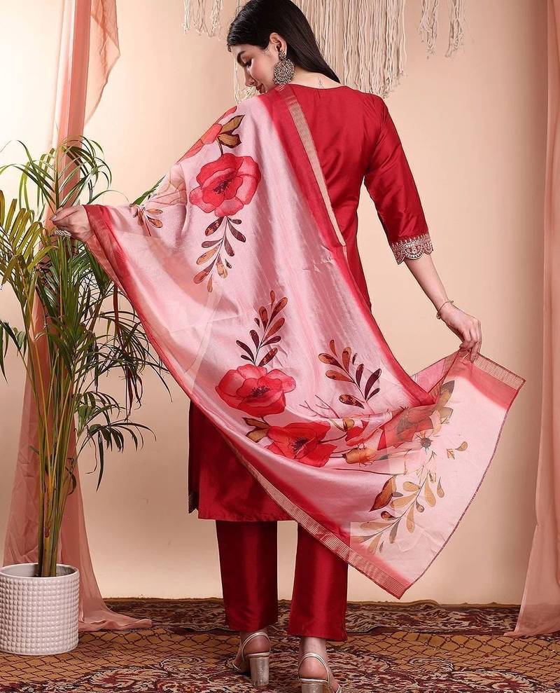 Red color art silk embroidered yoke design kurti pant dupatta set.