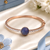 Rose gold finish sapphire orbit american diamond bracelet