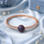 Rose gold finish sapphire orbit american diamond bracelet