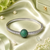 Rhodium finish emerald american diamond bracelet
