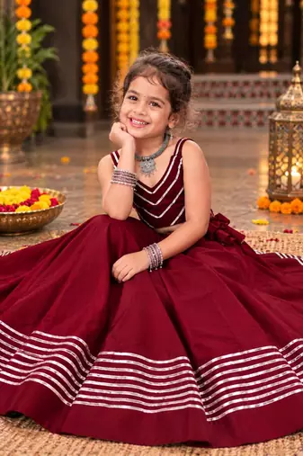 Maroon roman silk girls navratri lehenga choli set with fancy lace gota border sleeveless garba outfit