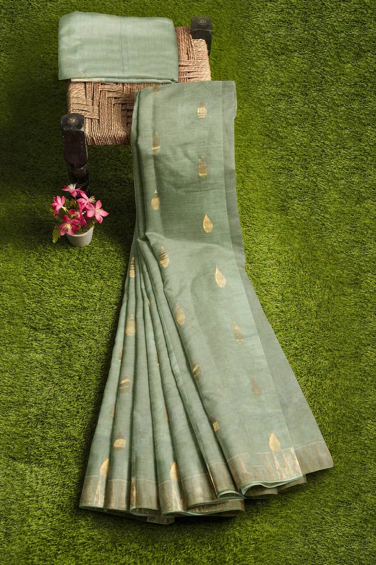 Elegant mint green linen saree with gold zari butta