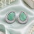 Rhodium finish serenity green halo earrings