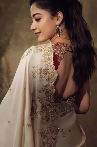 Rashmika style cream rangoli silk blend saree with sequins embroidery