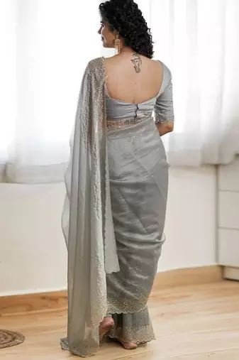 Grey fendy chiffon saree with artisan hand work & swarovski blouse