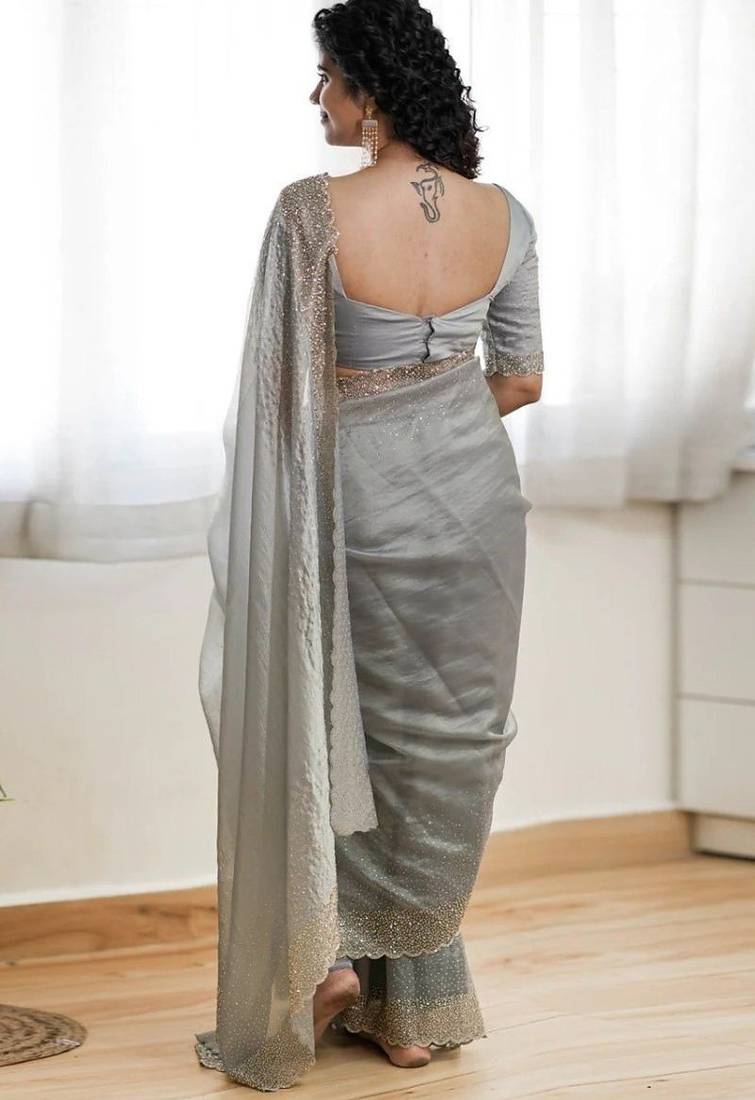 Grey fendy chiffon saree with artisan hand work & swarovski blouse