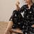 Quirky Printed Mandarin Collar A-Line Kurta With Trousers