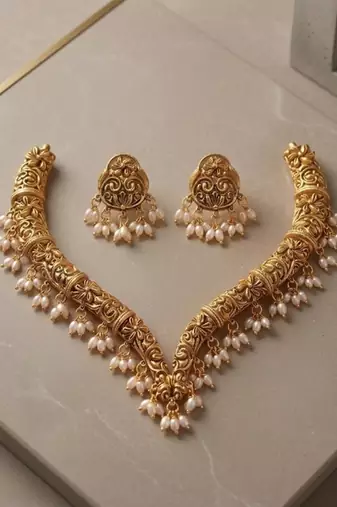 Handcrafted traditional gold-plated choker necklace set with pearl drops - ethnic jewelry for weddings