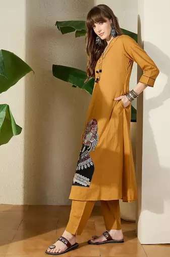 Women Mustard Embroidered A-Line Kurta Trousers Set