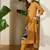 Women Mustard Embroidered A-Line Kurta Trousers Set