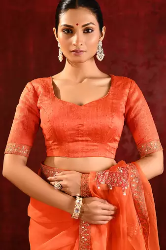 Bright orange embroidered organza saree set