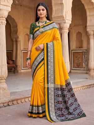 Yellow soft and smooth silk blend saree in patola style with detailed zari work 1