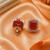Rose gold finish sunset ember halo studs