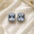 Rhodium finish crystal royale halo stud earrings