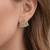 Black triangular stud earrings with crystals, gold plated, geometric design