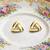 Triangle stud earrings with white enamel, gold tone geometric design, medium size, polished finish
