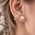 Pearl and crystal flower ear cuff earrings, gold tone, curved design with rhinestone floral accent