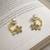 Pearl and crystal flower ear cuff earrings, gold tone, curved design with rhinestone floral accent