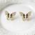 Butterfly stud earrings, gold tone with rhinestones, black enamel wings