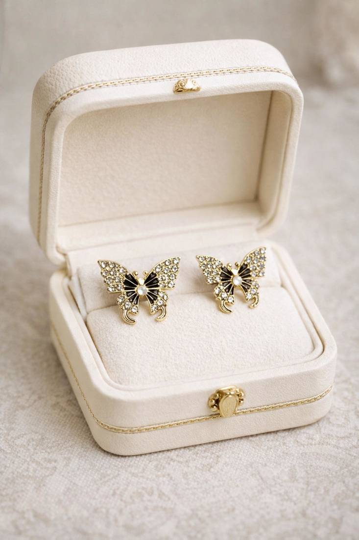 Butterfly stud earrings, gold tone with rhinestones, black enamel wings