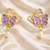 Butterfly earrings with pearl drop, purple and pink enamel, dangle stud style