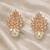 Rose gold crystal cluster earrings with pearl drop, marquise cut stones, stud style