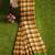 Mustard checked cotton blend saree with green border