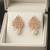 Rose gold crystal cluster earrings with pearl drop, marquise cut stones, stud style