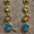 Gold tone drop earrings with multi-color crystal stones, dangle style, blue peach clear gems