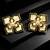 Flower stud earrings, gold-tone enamel with pearl centre, black and cream, push-back closure