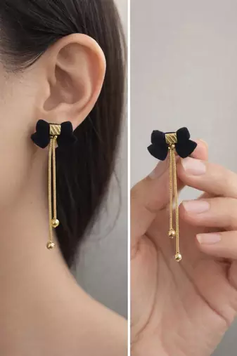 Black velvet bow stud earrings with gold chain tassel drop and ball ends, elegant dangle style