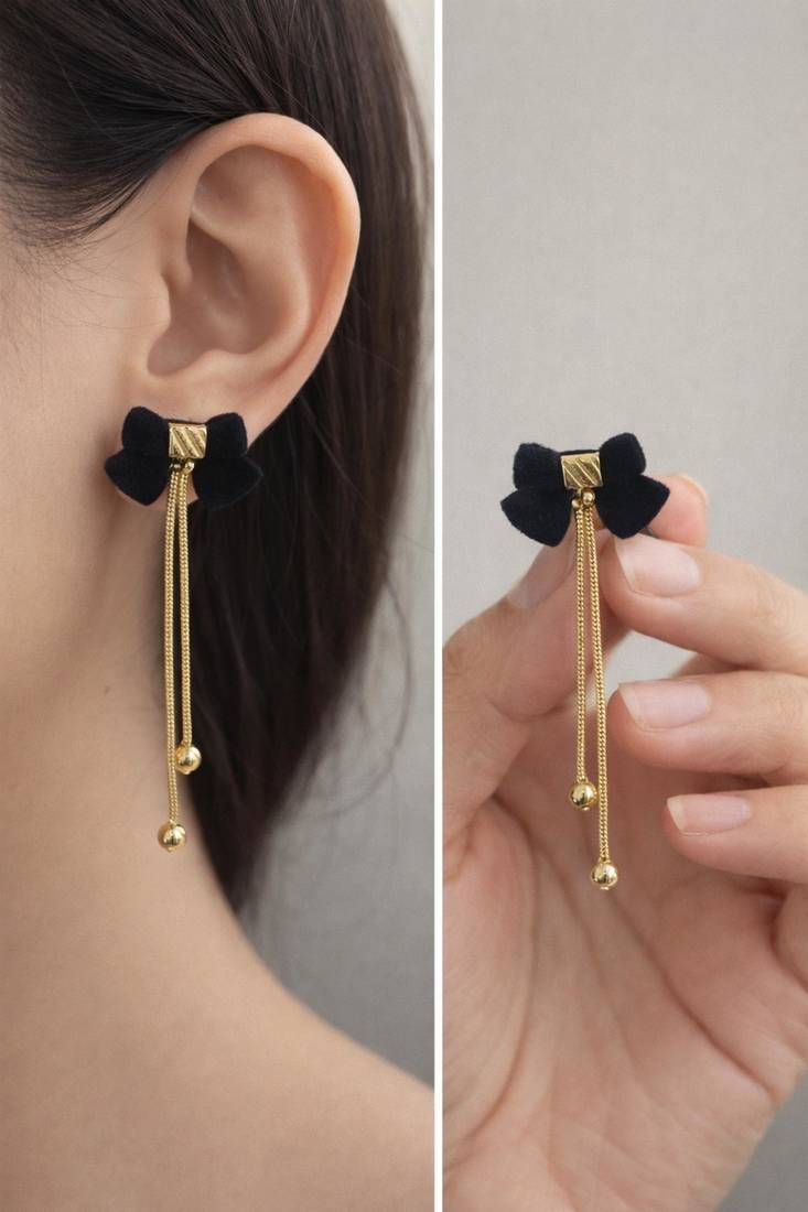 Black velvet bow stud earrings with gold chain tassel drop and ball ends, elegant dangle style