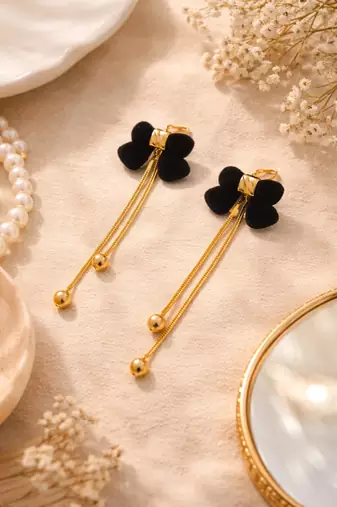 Black velvet bow stud earrings with gold chain tassel drop and ball ends, elegant dangle style