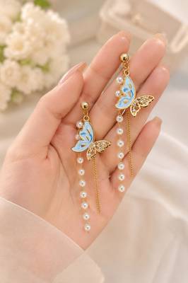 Blue enamel butterfly drop earrings with pearl chain tassel and crystal embellishments, gold-tone stud 1