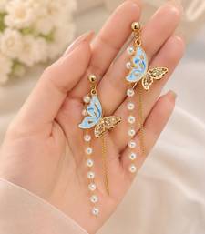 Blue enamel butterfly drop earrings with pearl chain tassel and crystal embellishments, gold-tone stud