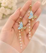 Blue enamel butterfly drop earrings with pearl chain tassel and crystal embellishments, gold-tone stud