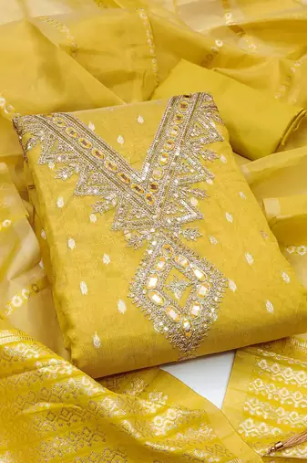 yellow  weaved shimmer butti unstitched dress material 