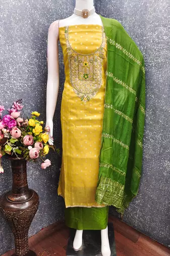 yellow  weaved shimmer butti unstitched dress material 