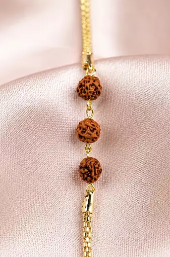 Divine rudraksha bead rakhi with gold-tone chain