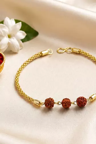 Divine rudraksha bead rakhi with gold-tone chain