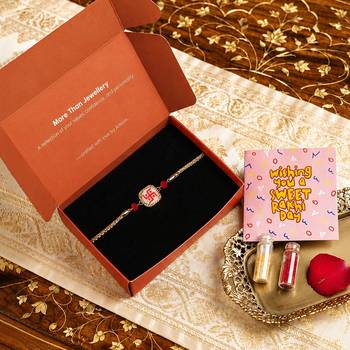 Traditional swastik charm rakhi with red beads 1