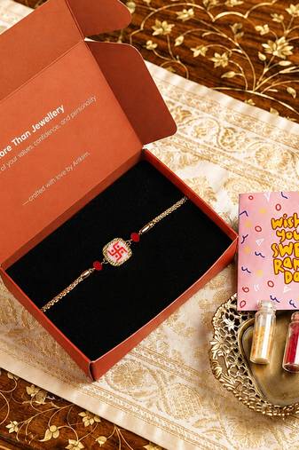 Traditional swastik charm rakhi with red beads
