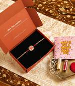 Traditional swastik charm rakhi with red beads