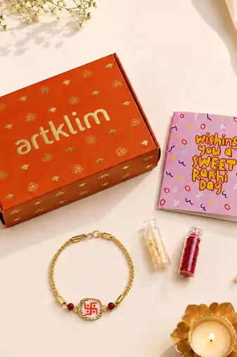 Traditional swastik charm rakhi with red beads