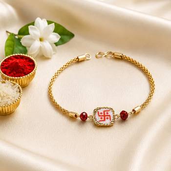 Traditional swastik charm rakhi with red beads 4