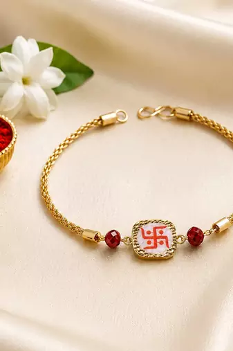 Traditional swastik charm rakhi with red beads